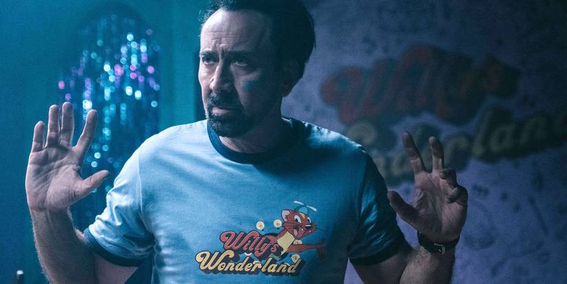 Nicolas Cage holds up his hands in Willy's Wonderland.