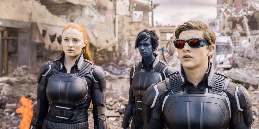Jean Grey, Scott Summers, and Kurt Wagner, walking through a decimated city and looking concerned in X-Men: Apocalypse