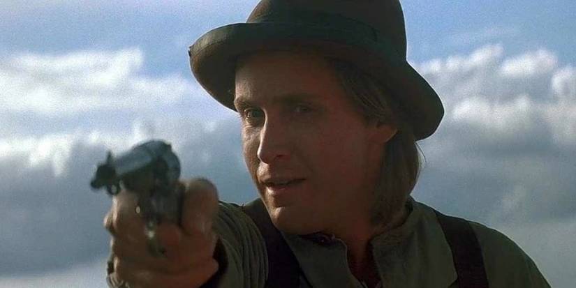 Emilio Estevez as Billy the Kid holding a pistol in Young Guns II. 