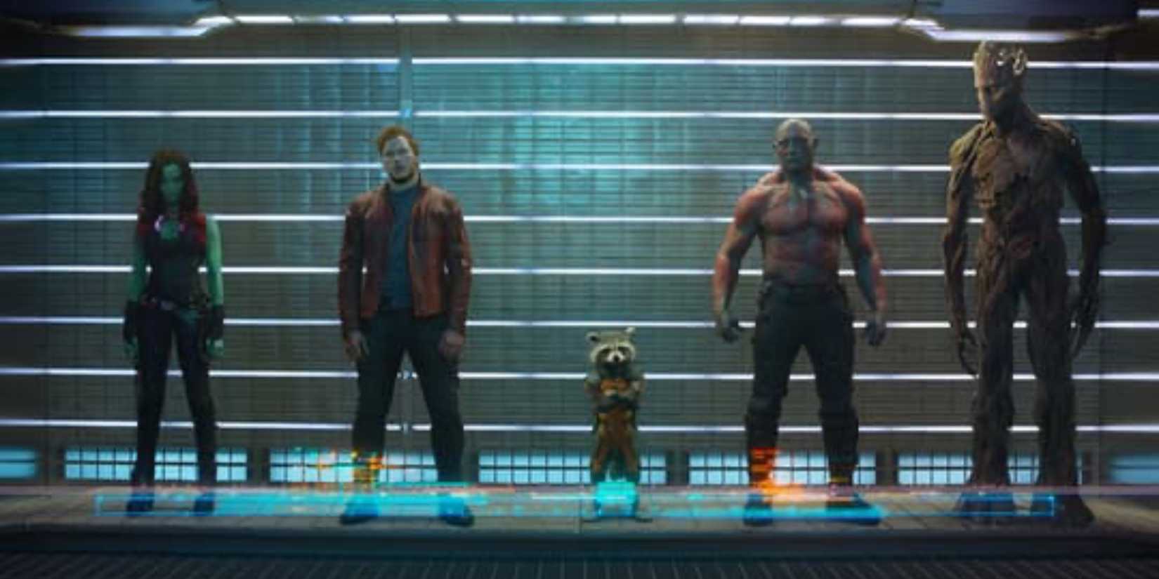Gamora, Peter Quill, Rocket, Drax the Destroyer, and Groot standing in a line-up 'Guardians of the Galaxy.'
