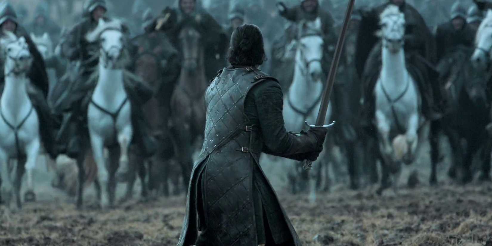 Jon stands alone, sword drawn, preparing to meet the charging enemy cavalry