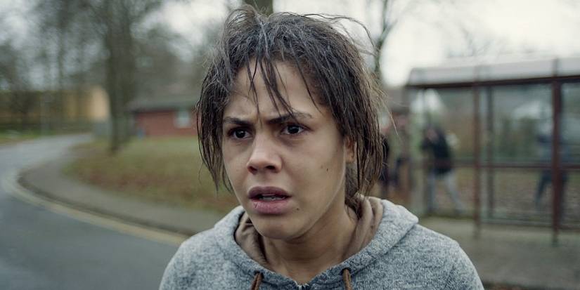Lenora Crichlow as Victoria in Black Mirror White Bear looking terrified, standing in the middle of the street.