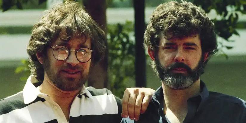 A young Steven Spielberg with his hand on a young George Lucas