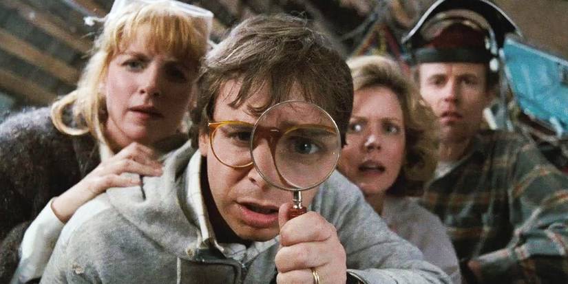 The four parents look close to the ground, one using a magnifying glass in Honey, I Shrunk the Kids.