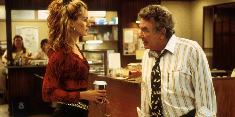 Julia Roberts And Albert Finney having an intense conversation in Erin Brockovich
