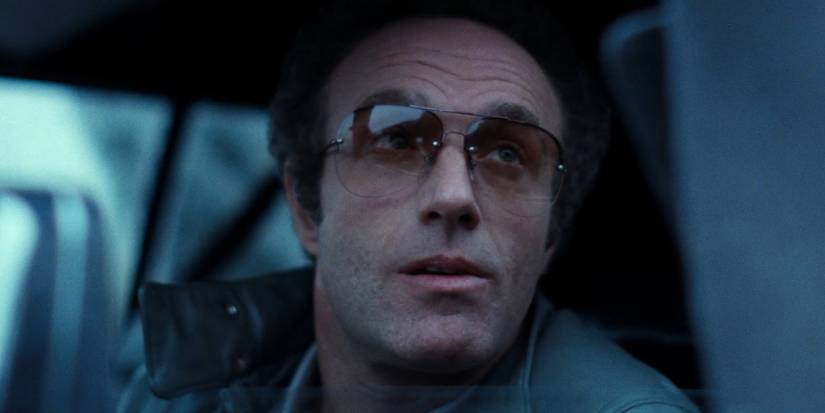 Frank looking out a car window in Thief.