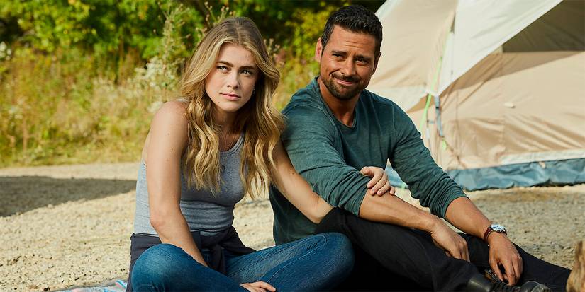 Melissa Roxburgh as Michaela sitting next to J.R. Ramirez as Jared on the ground in Manifest