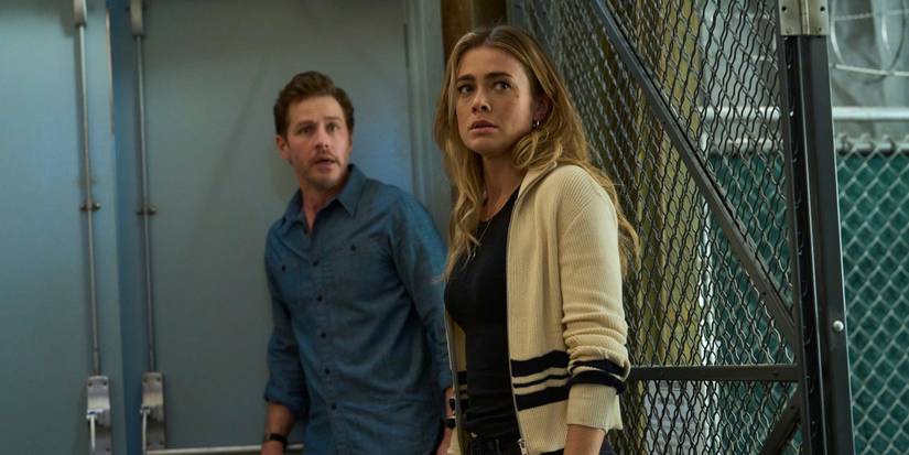 Josh Dallas as Ben Stone standing next to Melissa Roxburgh as Michaela Stone in Manifest Season 4