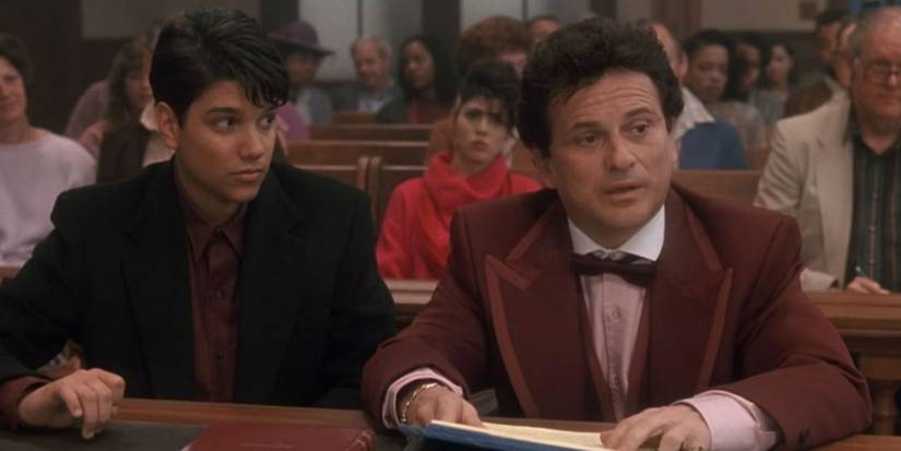 Billy (Ralph Macchio) and Vinny (Joe Pesci) sitting in the court room in My Cousin Vinny