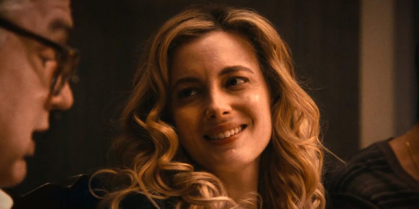 Gillian Jacobs as Tiffany in The Bear, at the dinner table smiling at Uncle Jimmy.