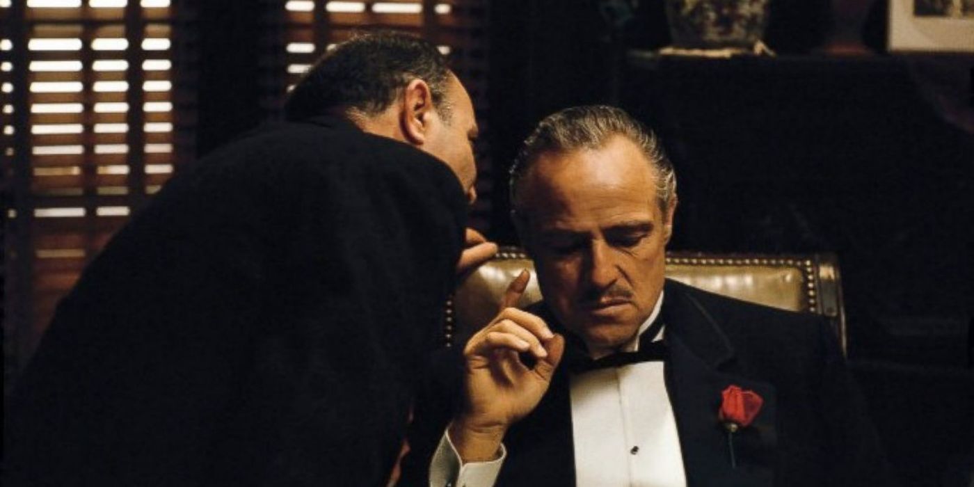 Salvatore Corsitto's Bonasera leaning down to whisper into Marlon Brando as Vito Corleone's ear in The Godfather's opening scene