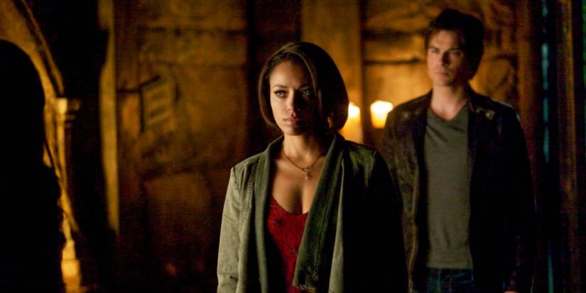 Bonnie, played by Kat Gramham, and Damon, played by Ian Somerhalder, in a crypt in 'The Vampire Diaries' Season 5.