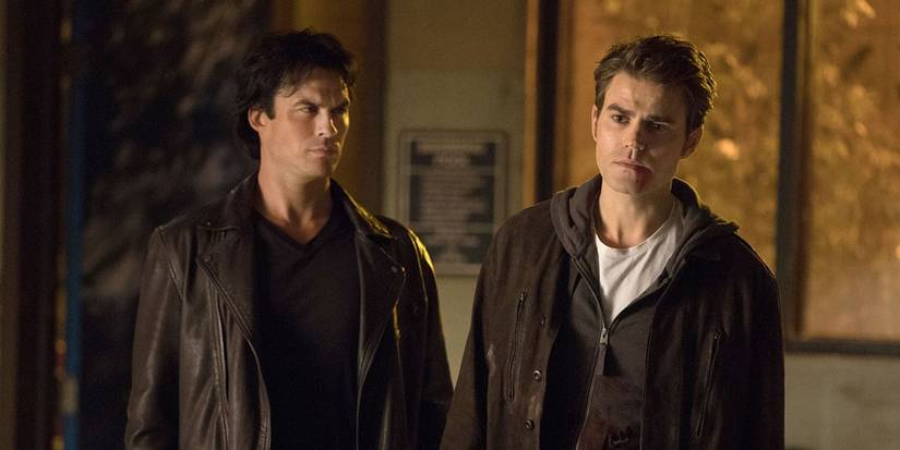 Damon, played by Ian Somerhalder, and Stefan, played by Paul Wesley, standing together in 'The Vampire Diaries' Season 8.