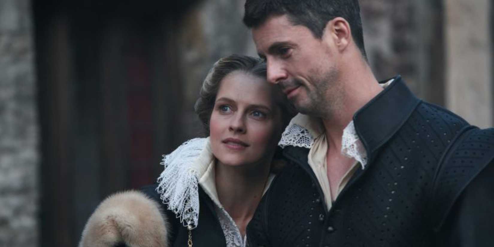 Matthew Goode and Teresa Palmer lean their heads together lovingly in A Discovery of Witches Season 2.
