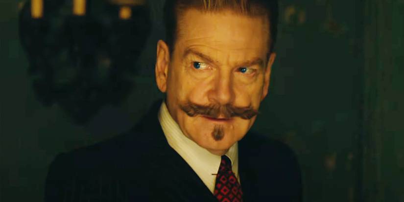 Kenneth Branagh as Hercule Poirot looking suspiciously to the side in A Haunting in Venice.