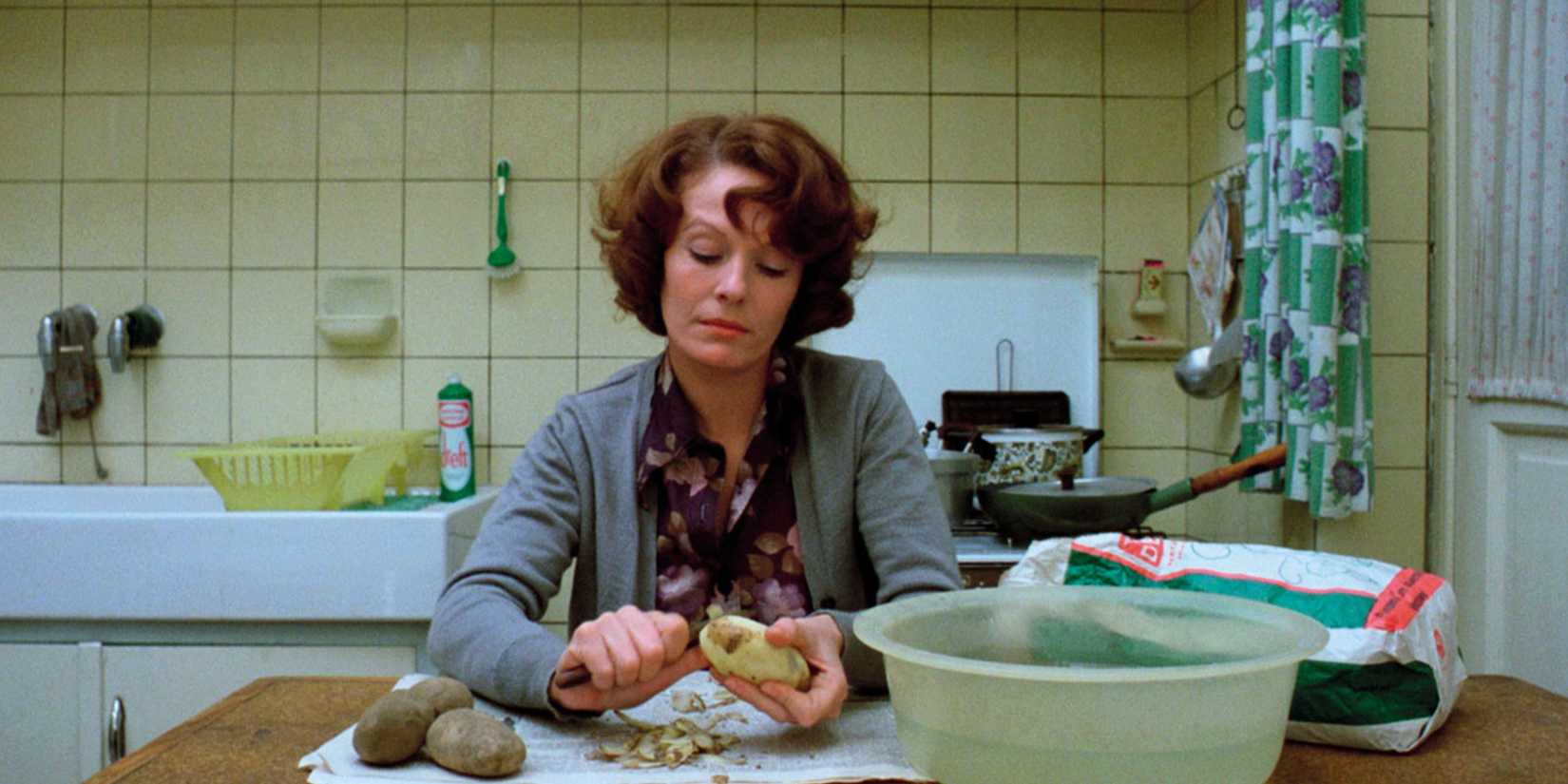 Delphine Seyrig as Jeanne Dielman peeling potatoes in Jeanne Dielman, 23 quai du Commerce, 1080 Bruxelles