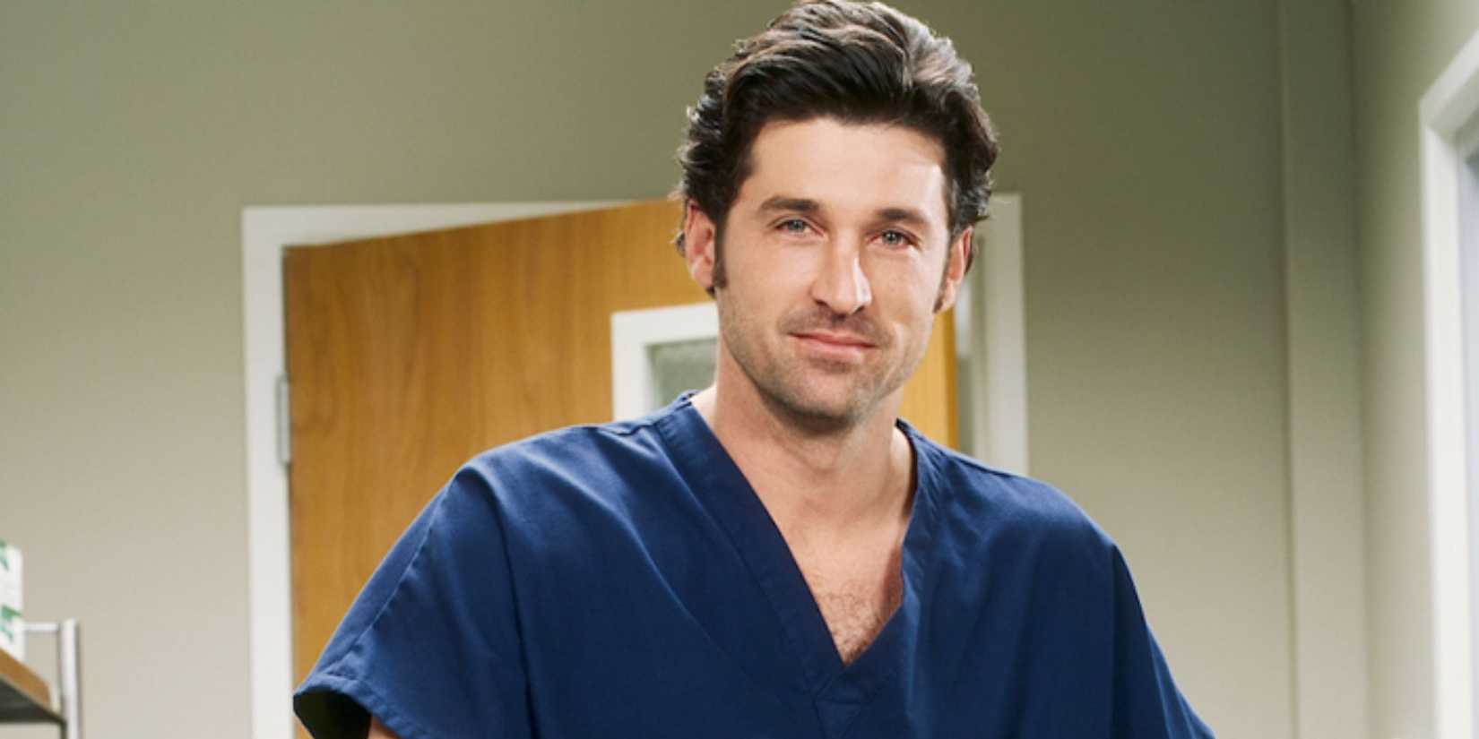 Derek Shepherd smiling at the camera in Grey's Anatomy