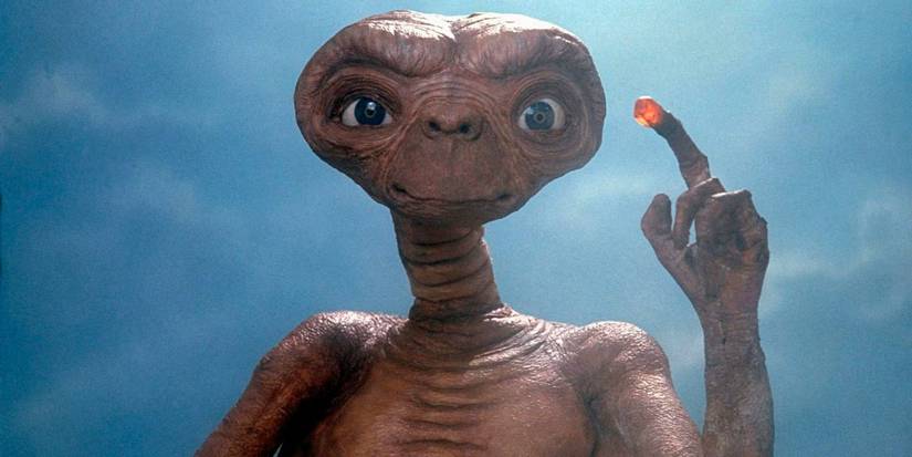 E.T. holds up his glowing finger in E.T. The Extra-Terrestrial.