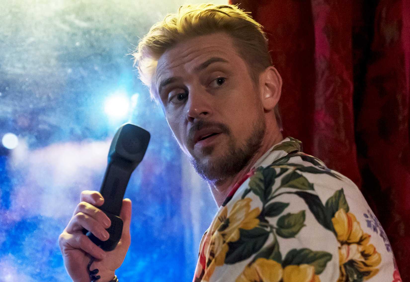 Boyd Holbrook as Clement Mansell holding a phone in his hand in Justified: City Primeval