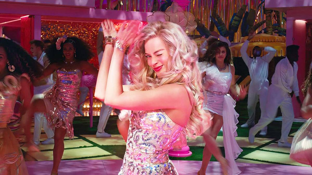 Margot Robbie as Barbie dancing at a party in Barbie.