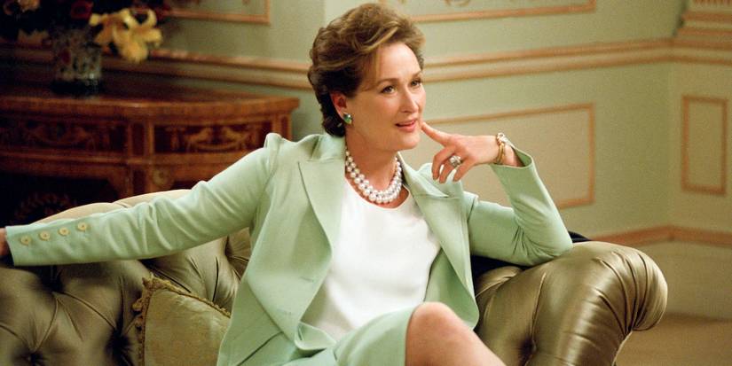 Meryl Streep as Ellie Shaw smiling cheekily with her index finger on her chin in 2004's The Manchurian Candidate