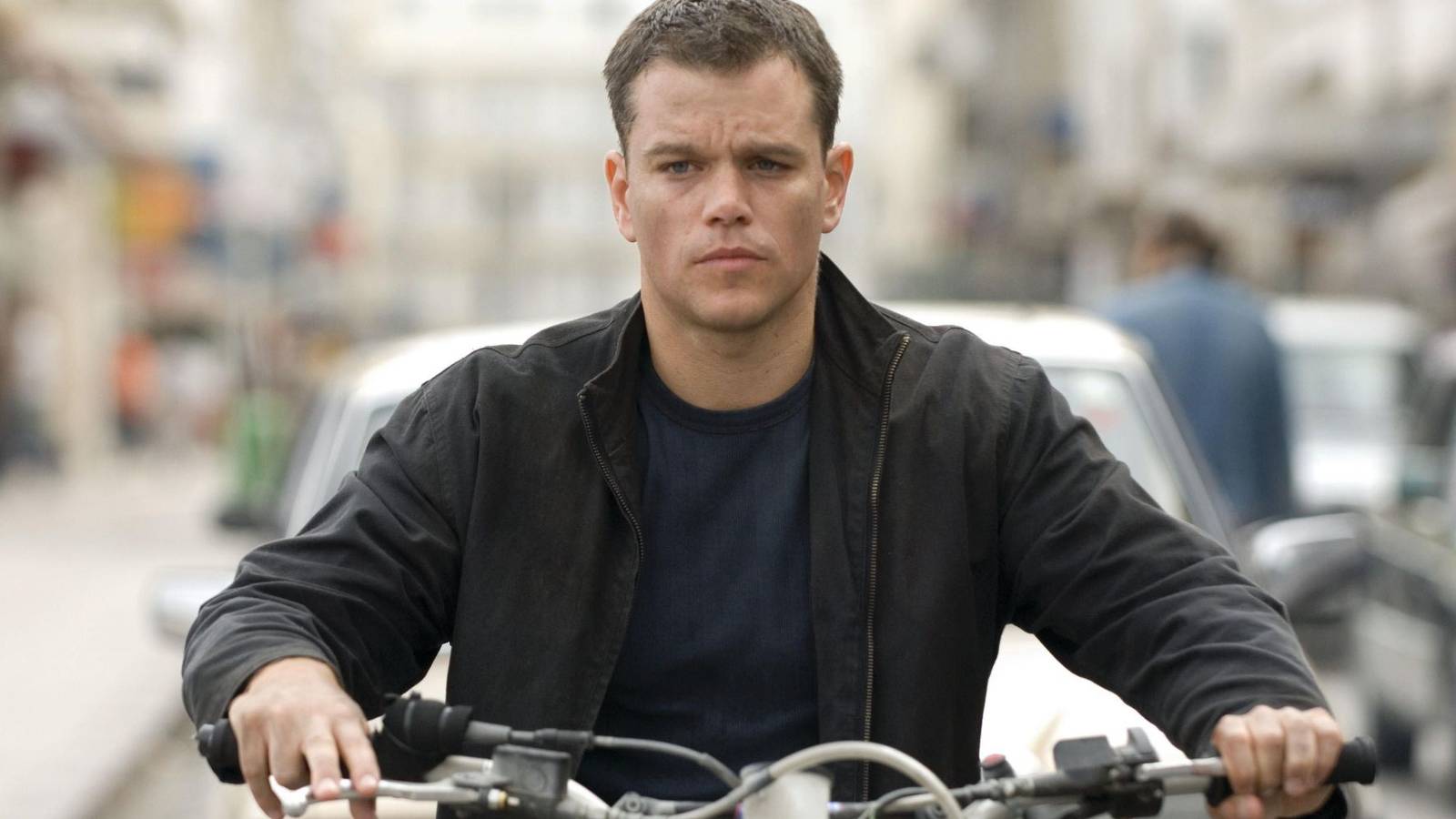 Matt Damon as Jason Bourne riding a motorcycle in The Bourne Ultimatum