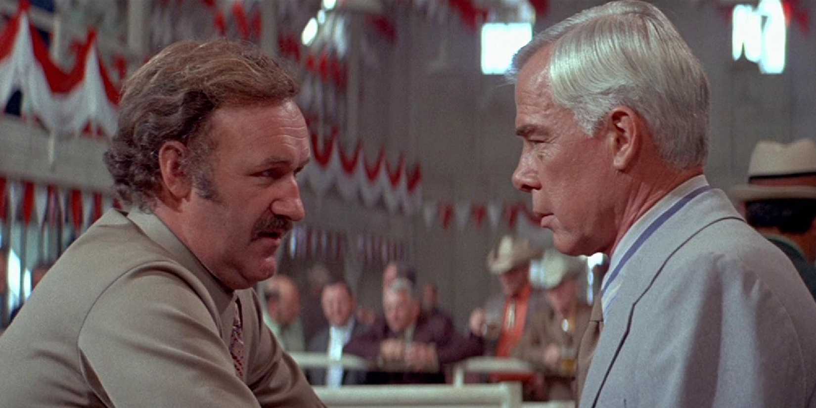 Gene Hackman talking to another man in Prime Cut