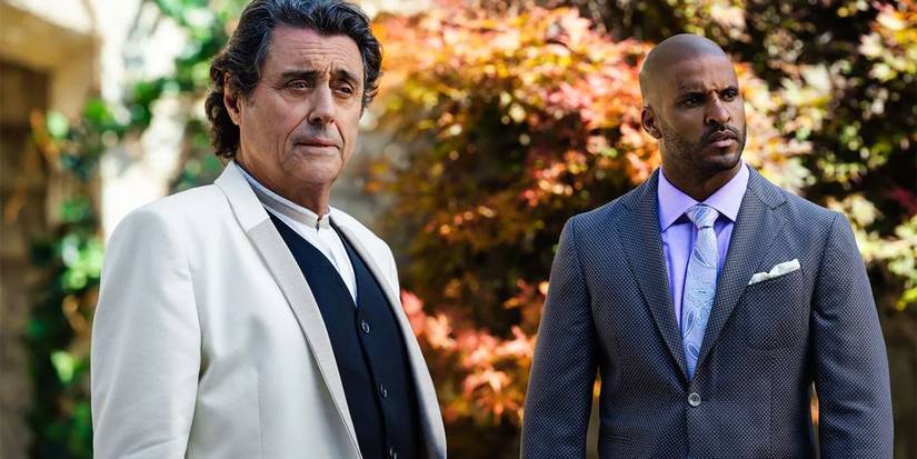 Shadow Moon and Mr. Wednesday in American Gods look at something off camera, confused.