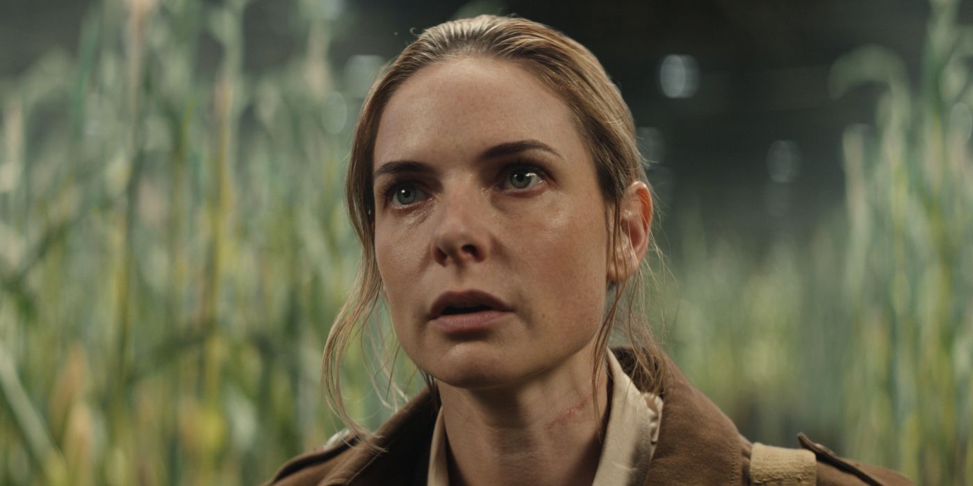 Juliette Nichols looking confused and looking ahead in a cornfield in 'Silo.'
