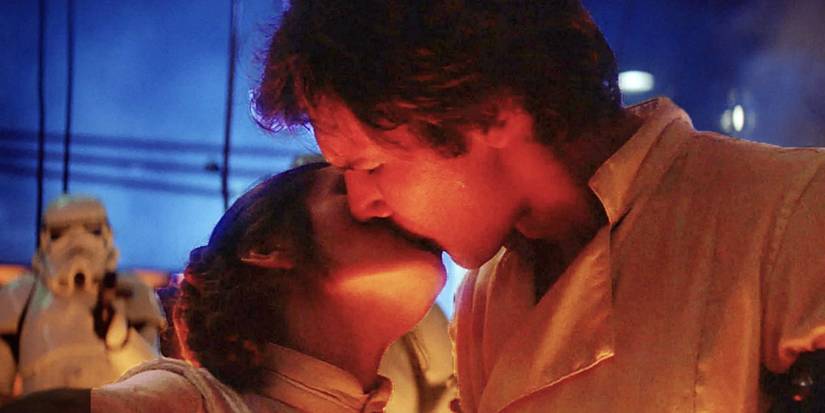 Han (Harrison Ford) and Leia (Carrie Fisher) kiss in the carbon-freezing chamber in The Empire Strikes Back.