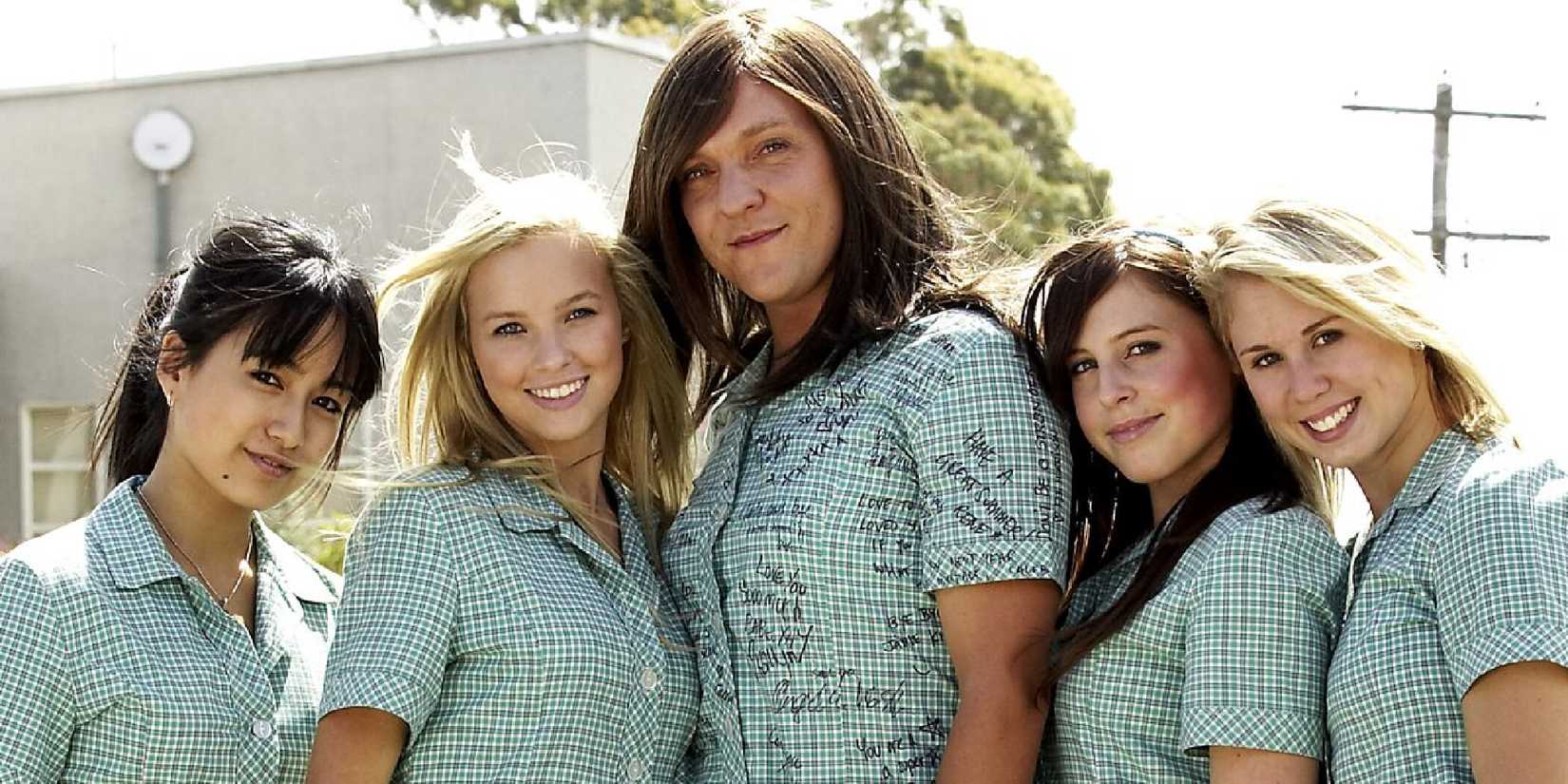 Characters in matching outfits look at the camera together in Summer Heights High.