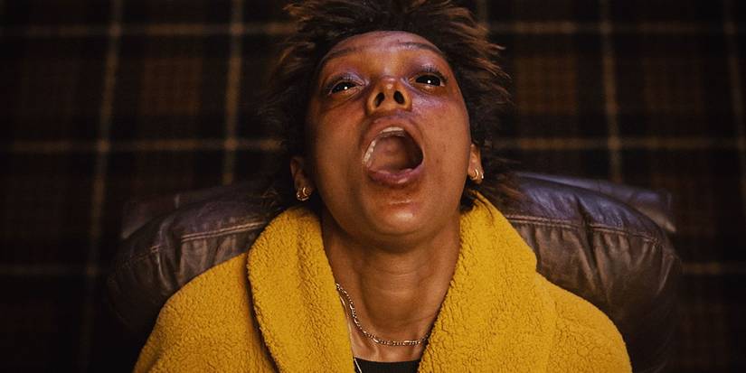 Sophie Wilde as Mia being possessed, with her head tipped back and mouth open in Talk to Me.