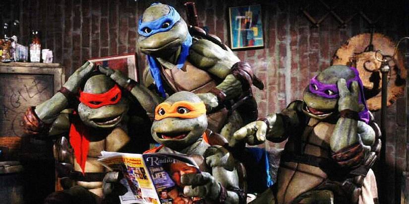 Leonardo, Raphael, Donatello, and Michelangelo read a magazine in 1990's Teenage Mutant Ninja Turtles.