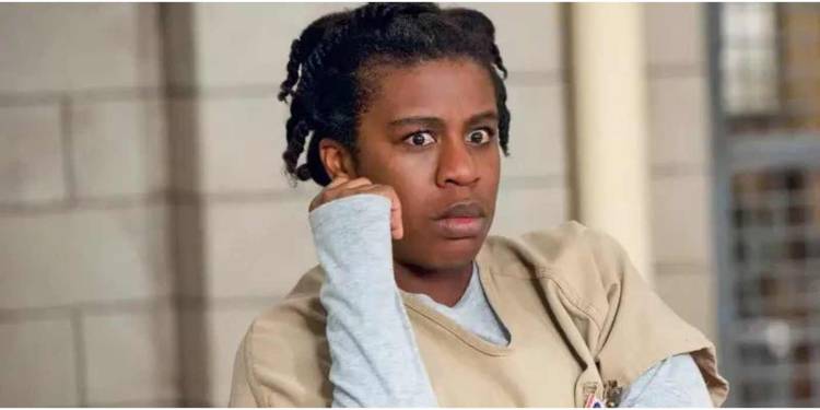 Uzo Aduba as Suzanne "Crazy Eyes" Warren staring with wide eyes in Orange Is the New Black.
