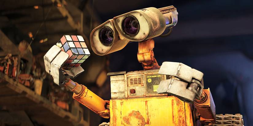 Wall-E looking curiously at a rubicks cube in the film Wall-E. 