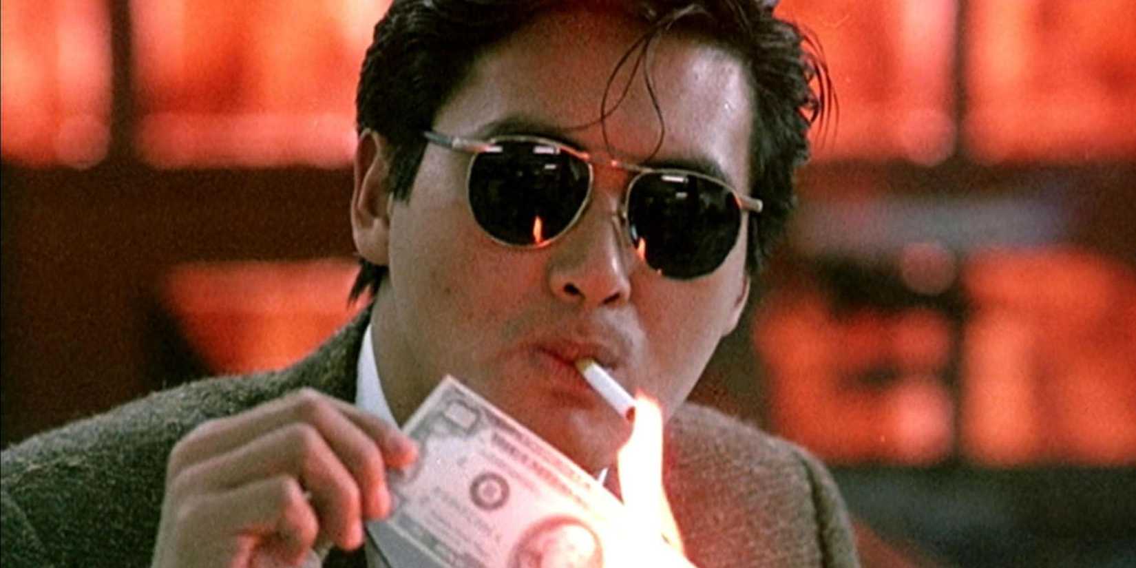 Chow Yun-Fat lighting a cigarette with a banknote that's on fire in A Better Tomorrow