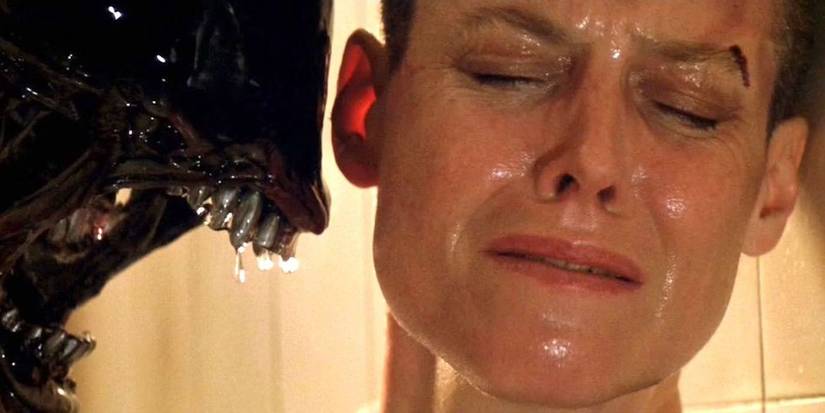 Ripley turns her head away from an open-mouthed Xenomorph in Alien 3.