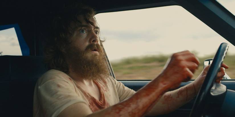 A scared-looking man driving a car in Blue Ruin