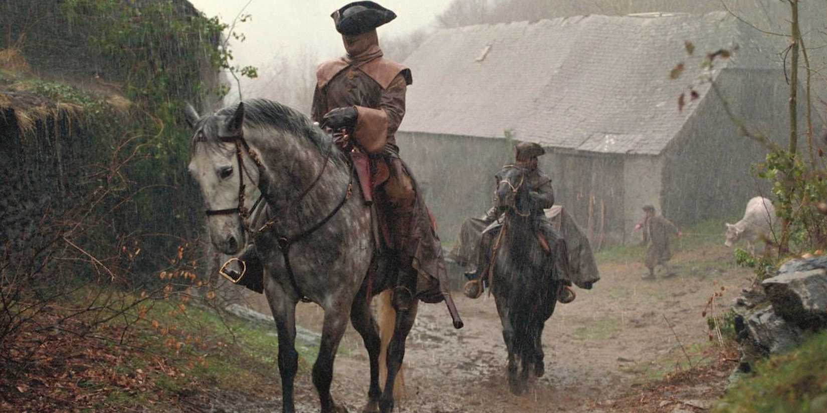 Two men on horseback in brotherhood of the wolf