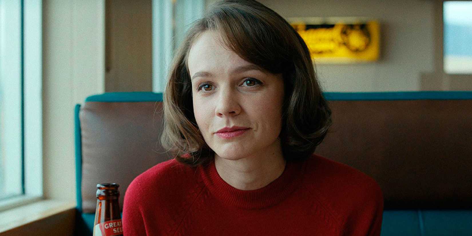 Carey Mulligan smirking in Wildlife close-up shot.