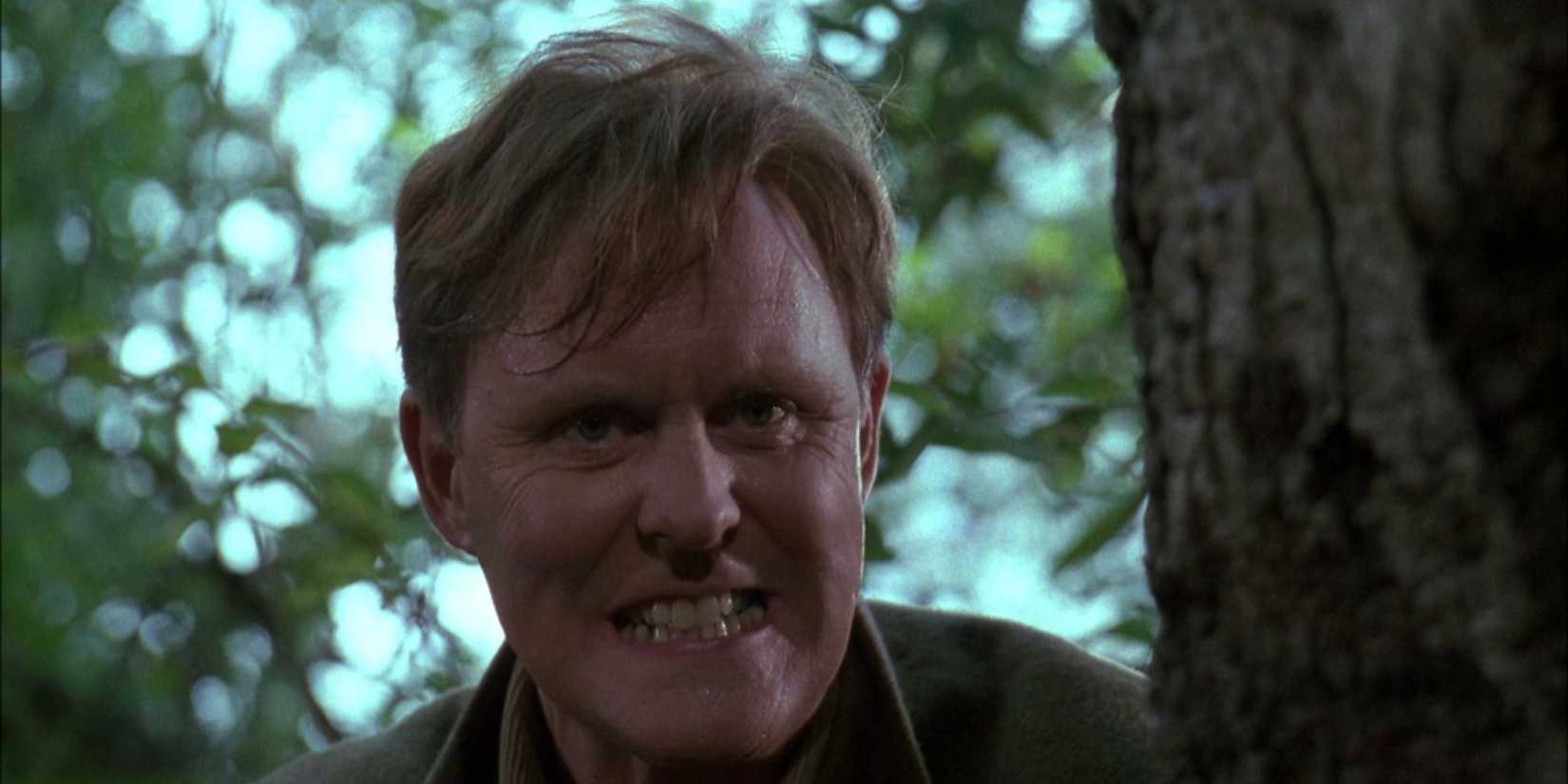 John Lithgow clenching his teeth in Raising Cain