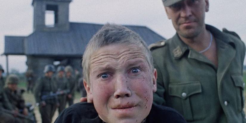 Flyora Gaishun stares at the camera looking horrified, a soldier holds his shoulder in Come and See