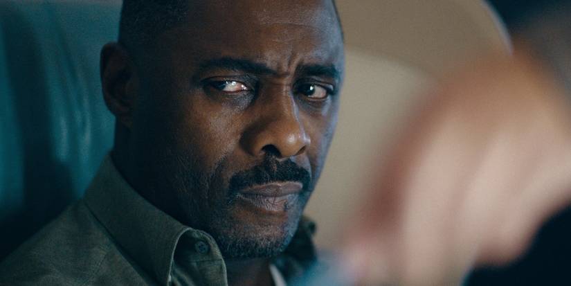Idris Elba as Sam looking back at a threat offscreen in Season 1, Episode 6 of 'Hijack.' 