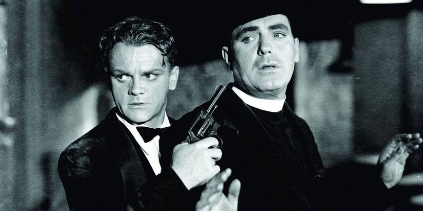 James Cagney holding and pointing a gun at Pat O'Brien in Angels with Dirty Faces.