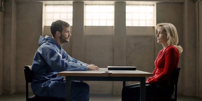 Jamie Dornan and Gillian Anderson sitting across a table as Paul Spector and Stella Gibson in The Fall