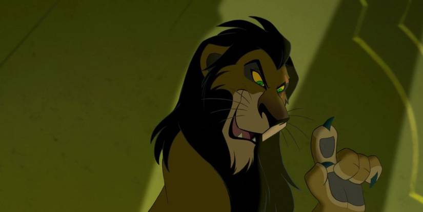 Scar with an evil smile raising his paw in The Lion King