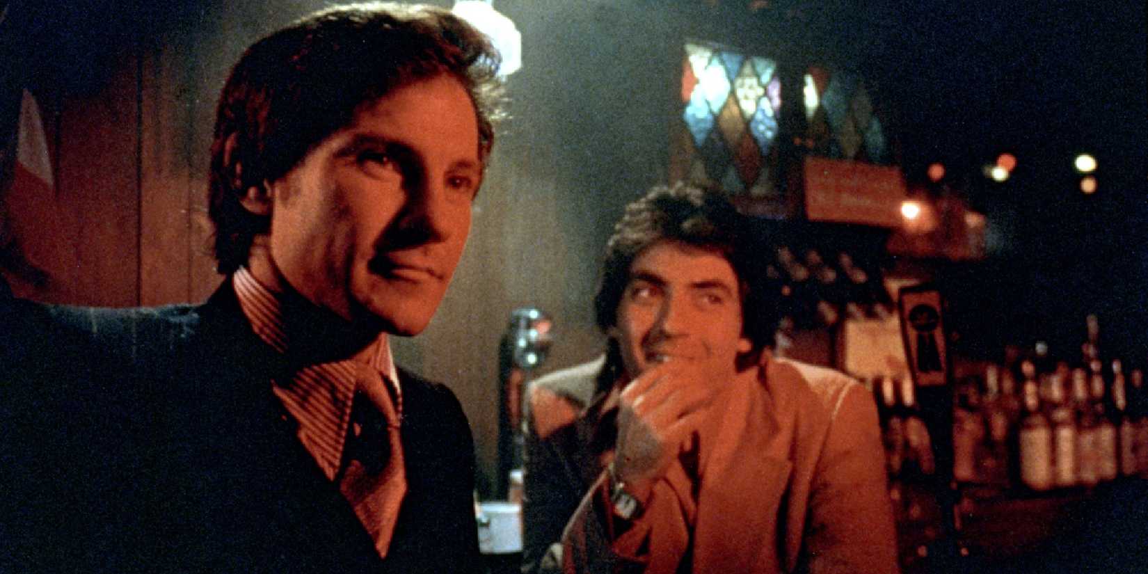 Charlie and Tony lean against a bar and smile in Mean Streets.