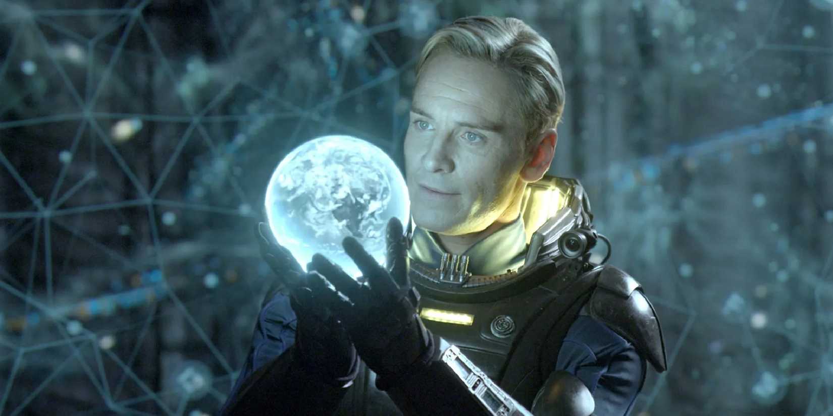 Michael Fassbender as David examining a glowing sphere in Prometheus.