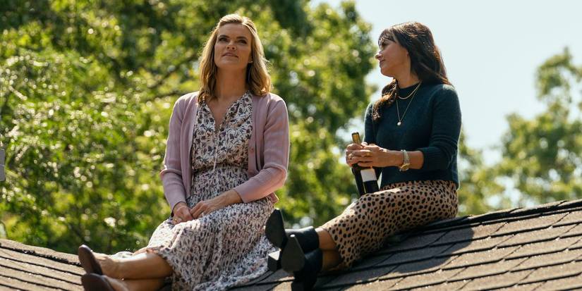Missi Pyle as Hannah and Constance Zimmer as Shira sitting on roof in Harlan Coben's Shelter.