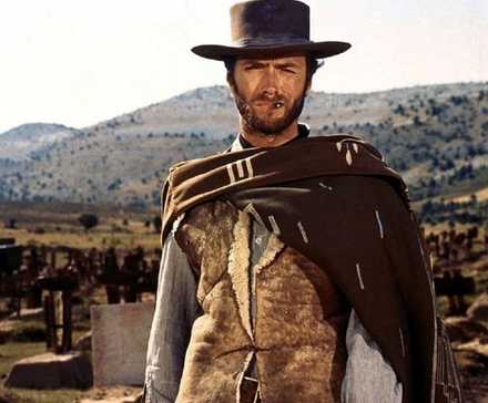 The Man with No Name looking ahead while standing in the desert in 'The Good, the Bad and the Ugly'